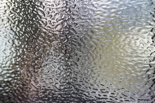 Embossed glass texture, Uneven glass surface background. Window patern. Wavy glass texture desktop pattern