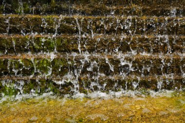 Splash of water in the fountain, nature background