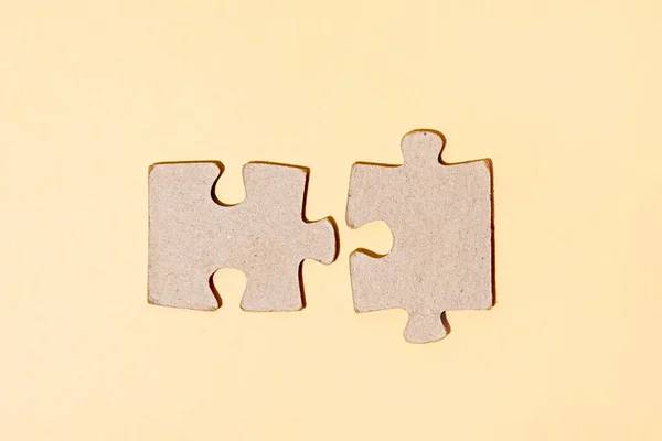 Puzzle pieces on light background. gray square puzzle pieces grid. Business background. close up