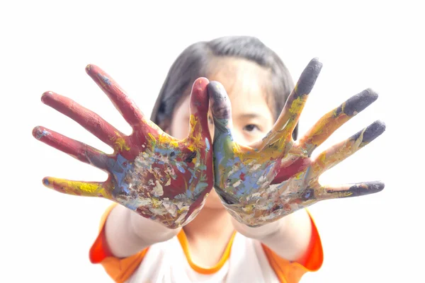Beautiful little girl with hands in the paint — Stock Photo, Image