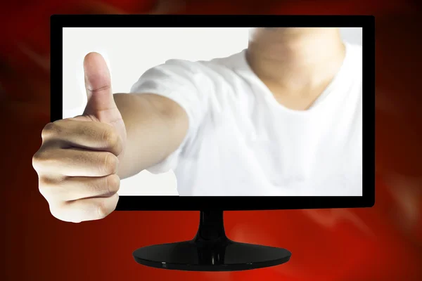 Man hand gesturing the ok sign on TV — Stock Photo, Image