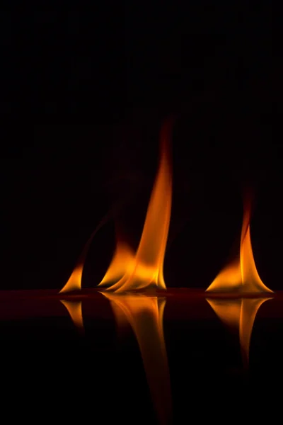 Fire flames on a background — Stock Photo, Image