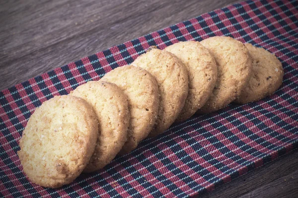 Cookies on borwn fabric — Stock Photo, Image