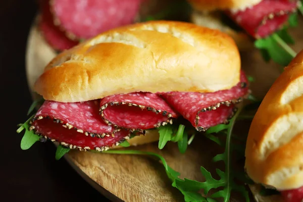 Salami Sandwiches Arugula Mustard Wooden Board — Zdjęcie stockowe