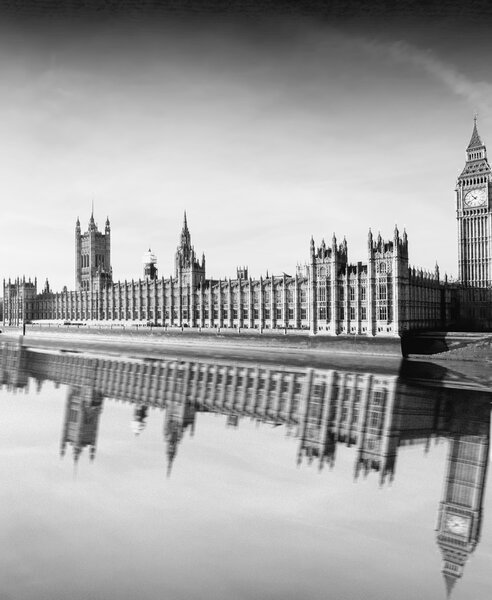 Westminster palace and Big Ben reflection on the Thames.