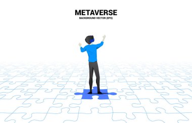 Silhouette businessman wear VR glasses standing on jigsaw. Concept of digital virtual reality technology and AR .
