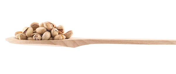 Spoon full of pistachio isolated — Stock Photo, Image