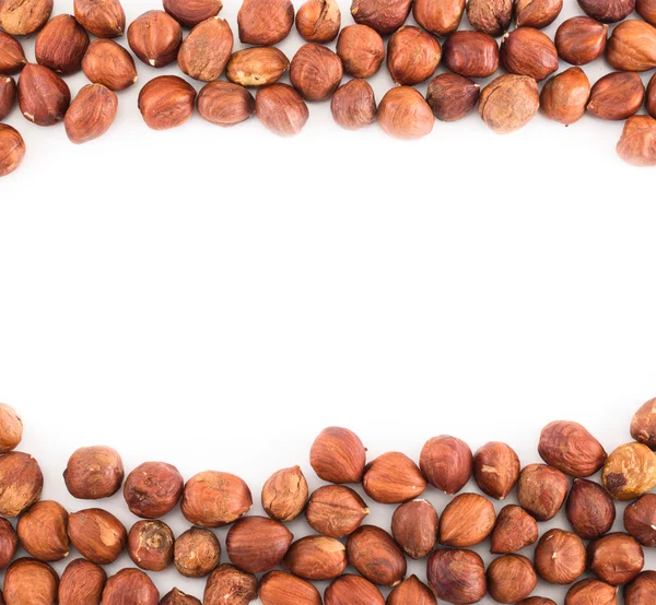 Hazelnuts over white surface background — Stock Photo, Image