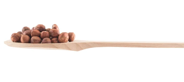 Spoon full of hazelnuts isolated — Stock Photo, Image