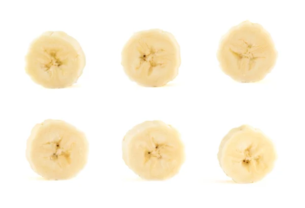 Seks bananskiver sat over hvid baggrund - Stock-foto