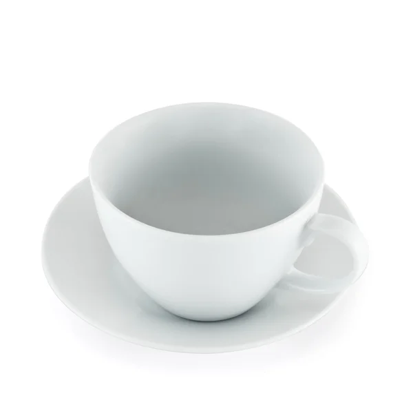 Vazio copo de chá de cerâmica sobre placa branca — Fotografia de Stock