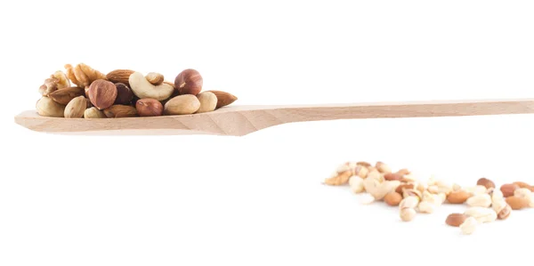 Spoon full of nuts mix over white — Stock Photo, Image