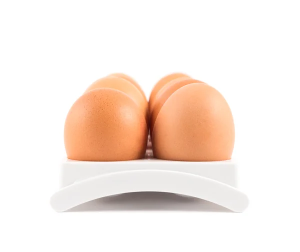 Dezenas de ovos em um caso isolado — Fotografia de Stock