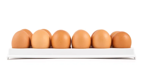 Kilkanaście jaj w przypadku na białym tle — Zdjęcie stockowe