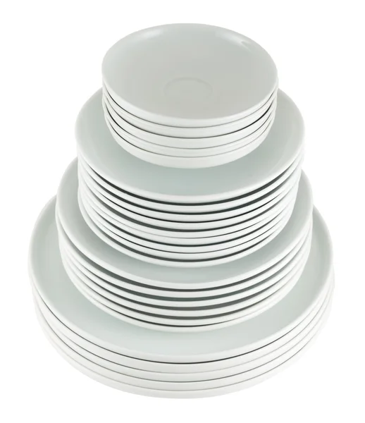 Pile of clean white dish plates isolated — Stock Photo, Image