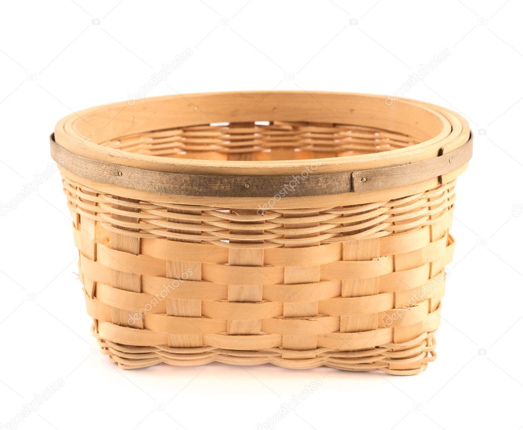 Wooden wicker basket isolated over white