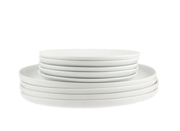 Pile of clean white dish plates isolated — Stock Photo, Image