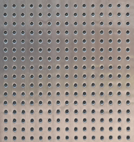 Perforated metal surface texture — Stock Photo, Image