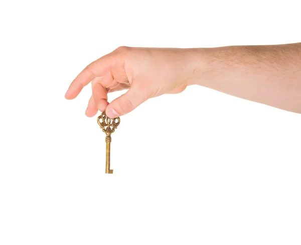 Mão segurando uma chave isolada — Fotografia de Stock
