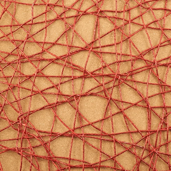 Cork mat covered with red thread — Stock Photo, Image
