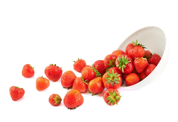 Scattered strawberries in a bowl — Stock Photo, Image