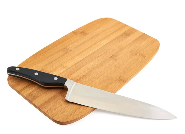 Knife over wooden cutting board — Stock Photo, Image