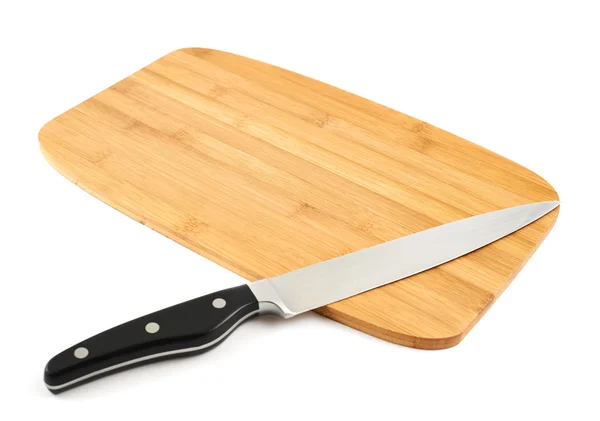 Knife over wooden cutting board — Stock Photo, Image