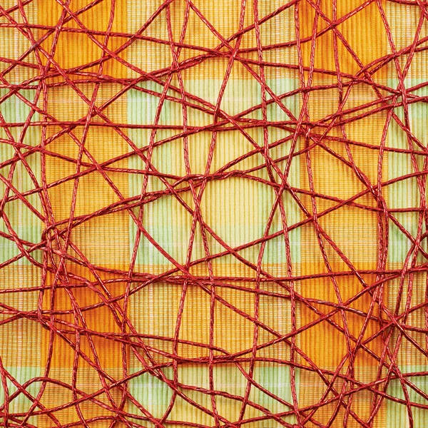 Cloth mat covered with red thread — Stock Photo, Image