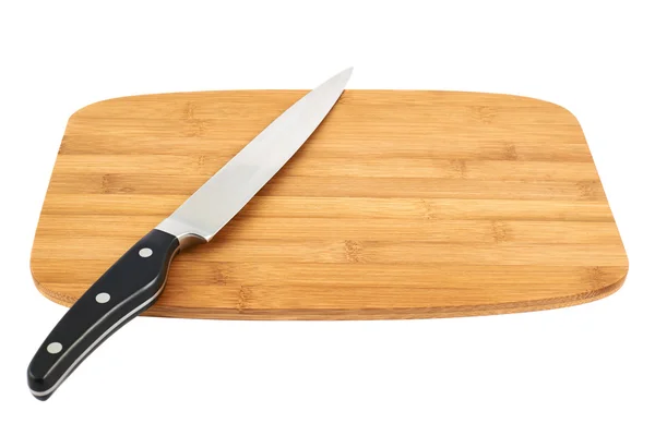 Cuchillo sobre tabla de cortar de madera — Foto de Stock