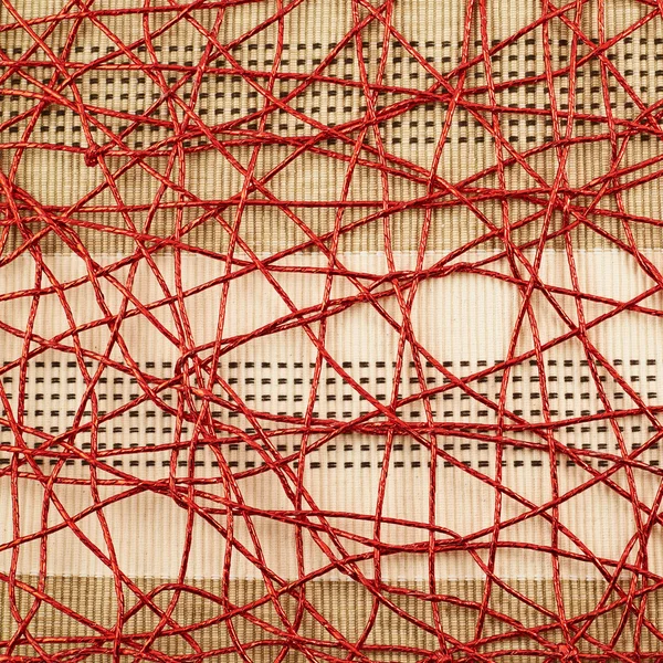 Cloth mat covered with red thread — Stock Photo, Image