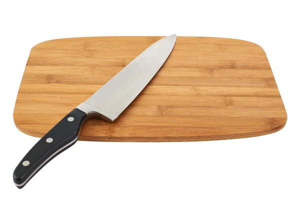 Нож над деревянной доской — стоковое фото