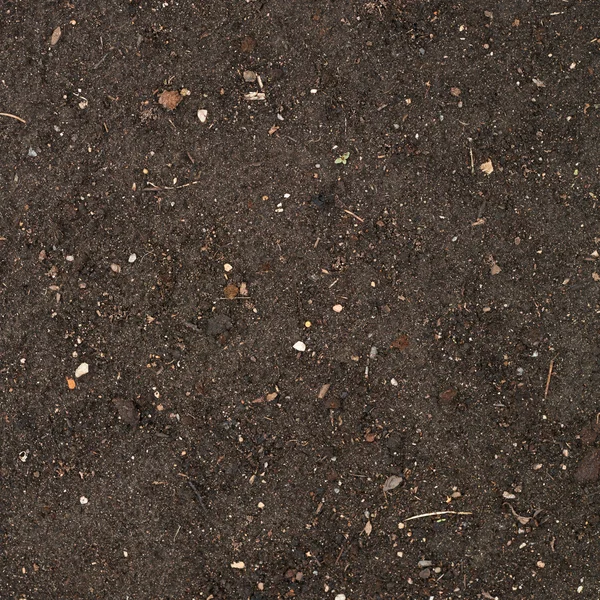 Земная текстура с небольшой каменной примесью — стоковое фото