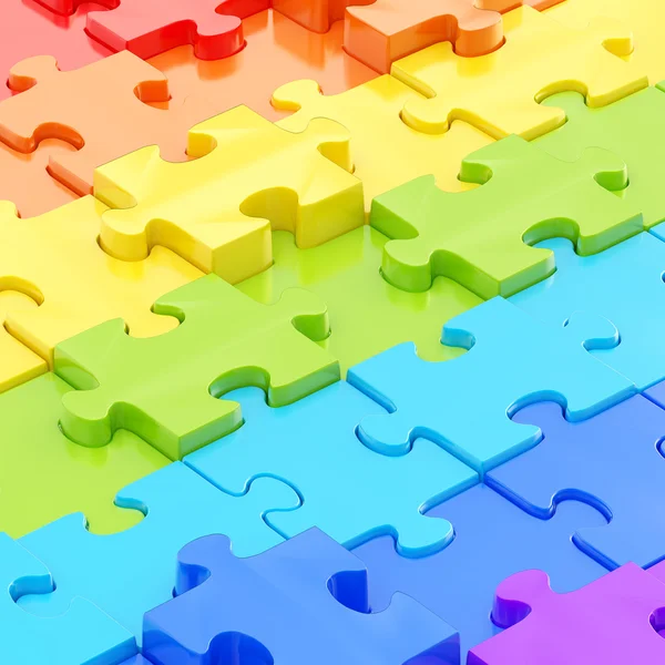 Puzzle pieces covered surface — Stock Photo, Image