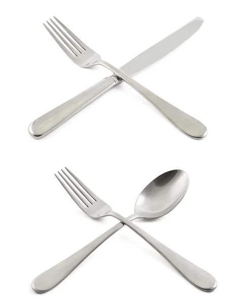 Tenedor cruzado con un cuchillo y una cuchara —  Fotos de Stock