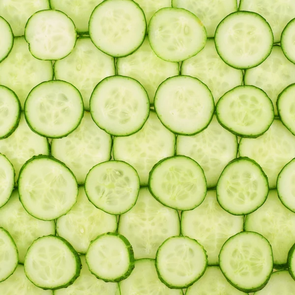 Surface coated with a cucumber slices — Stock Photo, Image