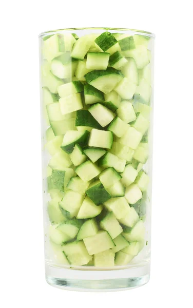 Tall glass full of cucumber pieces — Stock Photo, Image