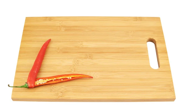 Sliced chili pepper over a cutting board — Stock Photo, Image