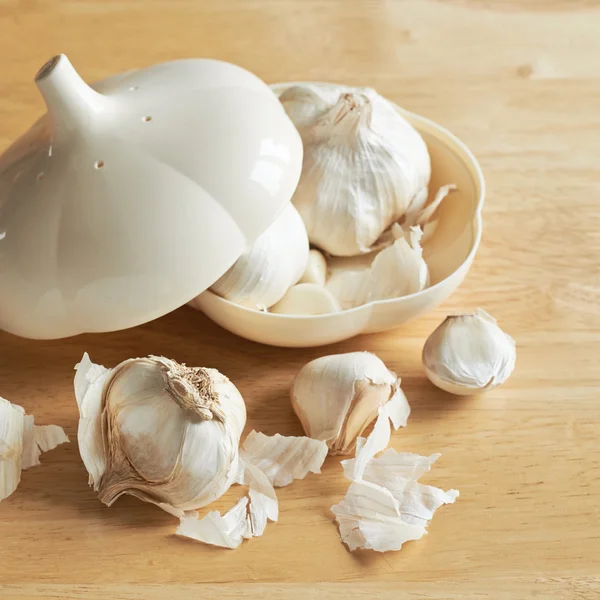 Garlic in a garlic shaped box — Stock Photo, Image