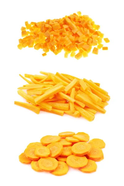 Piles of carrots cut in pieces, circles and sticks — Stock Photo, Image