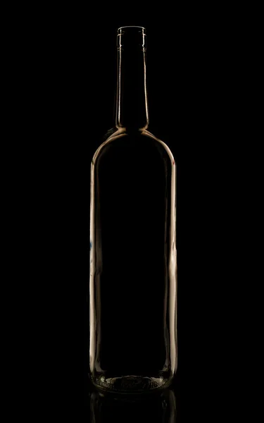 Botella de vidrio en la iluminación de bajo perfil — Foto de Stock