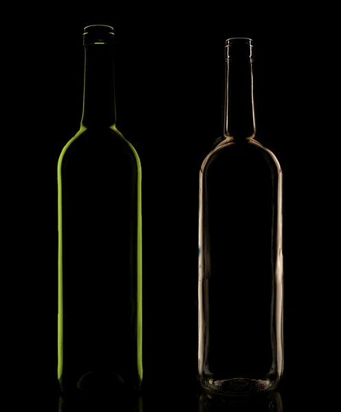 Botellas de vidrio en la iluminación de bajo perfil —  Fotos de Stock