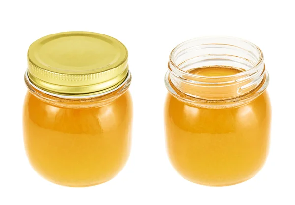 Zárt és nyitott méz üvegek — Stock Fotó