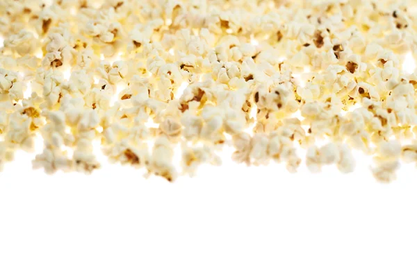 Biała powierzchnia pokryta popcorn — Zdjęcie stockowe