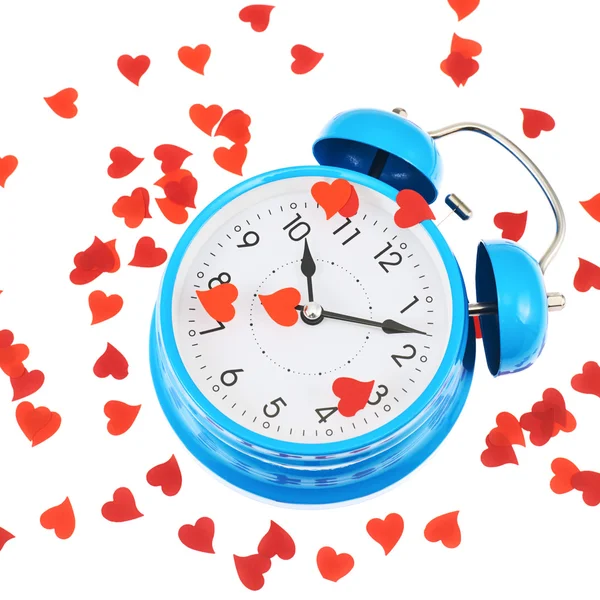 Alarm clock covered with hearts — Stock Photo, Image