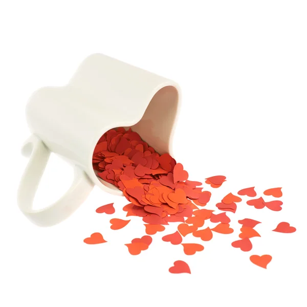 Heart confetti falling out of the cup — Stock Photo, Image