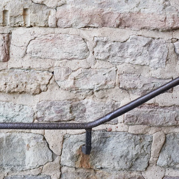 Metal railing on the old wall — Stock Photo, Image
