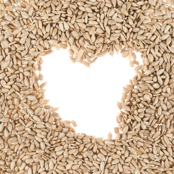 Hearth shaped sunflower seeds frame — Stock Photo, Image