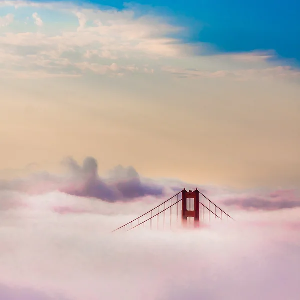 World Famous Golden Gate Bridge Surrounded by Fog after Sunrise in San Francisco,Californiaa — Stock Photo, Image