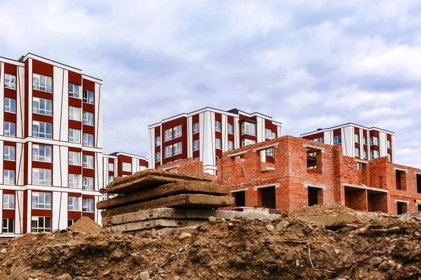 Brick house and concrete slabs at construction site