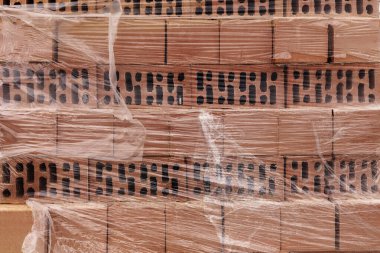 Tuğla palet. Tuğla Arkaplan. Tuğlalı paletler. Masonluk. Yeni tuğlalar. 